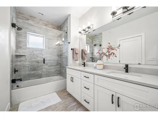 a bathroom with a granite countertop sink mirror and a