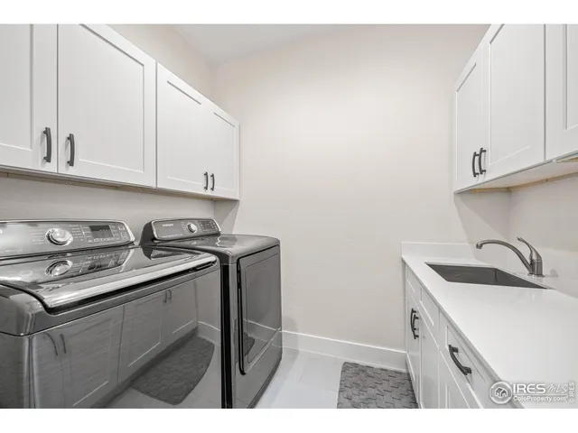 a kitchen with a sink dishwasher and cabinets