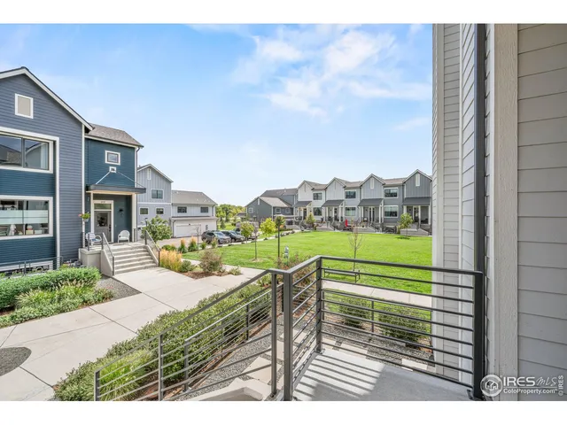 a view of a house with a yard from a terrace