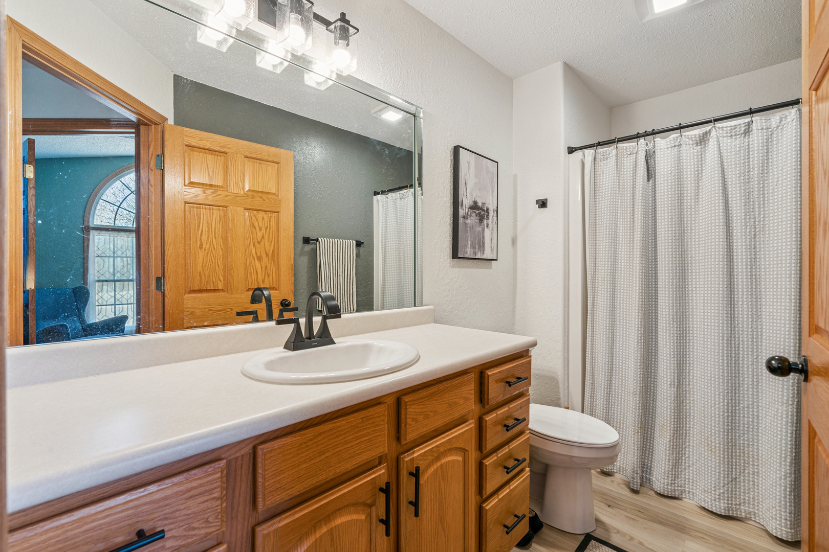 728 10th Ave Court Hampton, IL 61256 - Photo 14 of 35 a bathroom with a sink a toilet and mirror