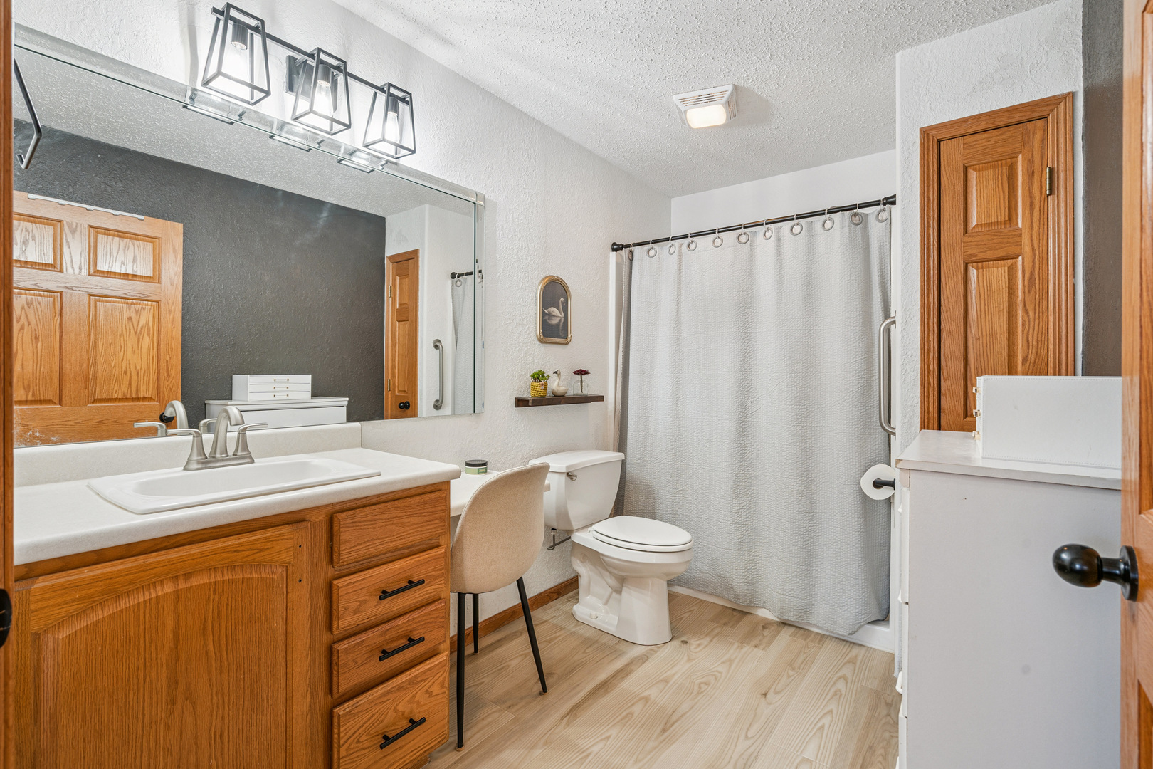 728 10th Ave Court Hampton, IL 61256 - Photo 17 of 35 a bathroom with a sink toilet a mirror and shower