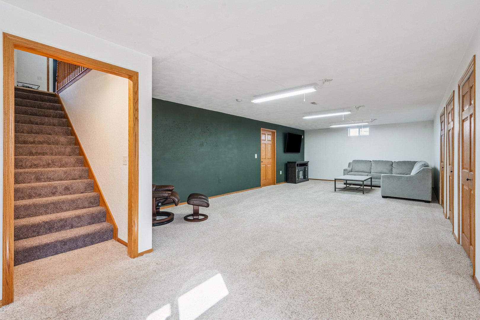 728 10th Ave Court Hampton, IL 61256 - Photo 18 of 35 a view of a livingroom with furniture and stairs