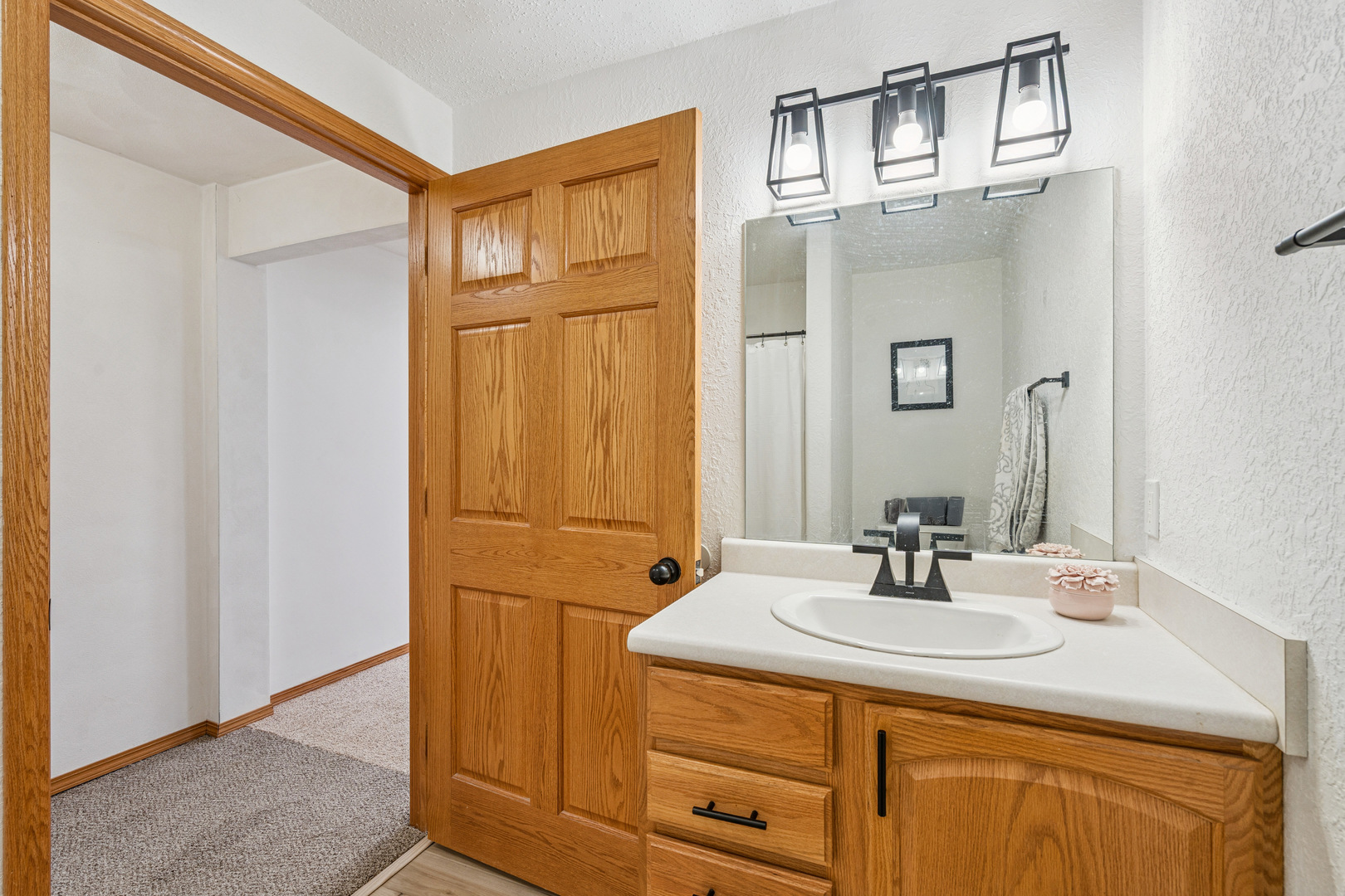728 10th Ave Court Hampton, IL 61256 - Photo 20 of 35 a bathroom with a sink and a mirror