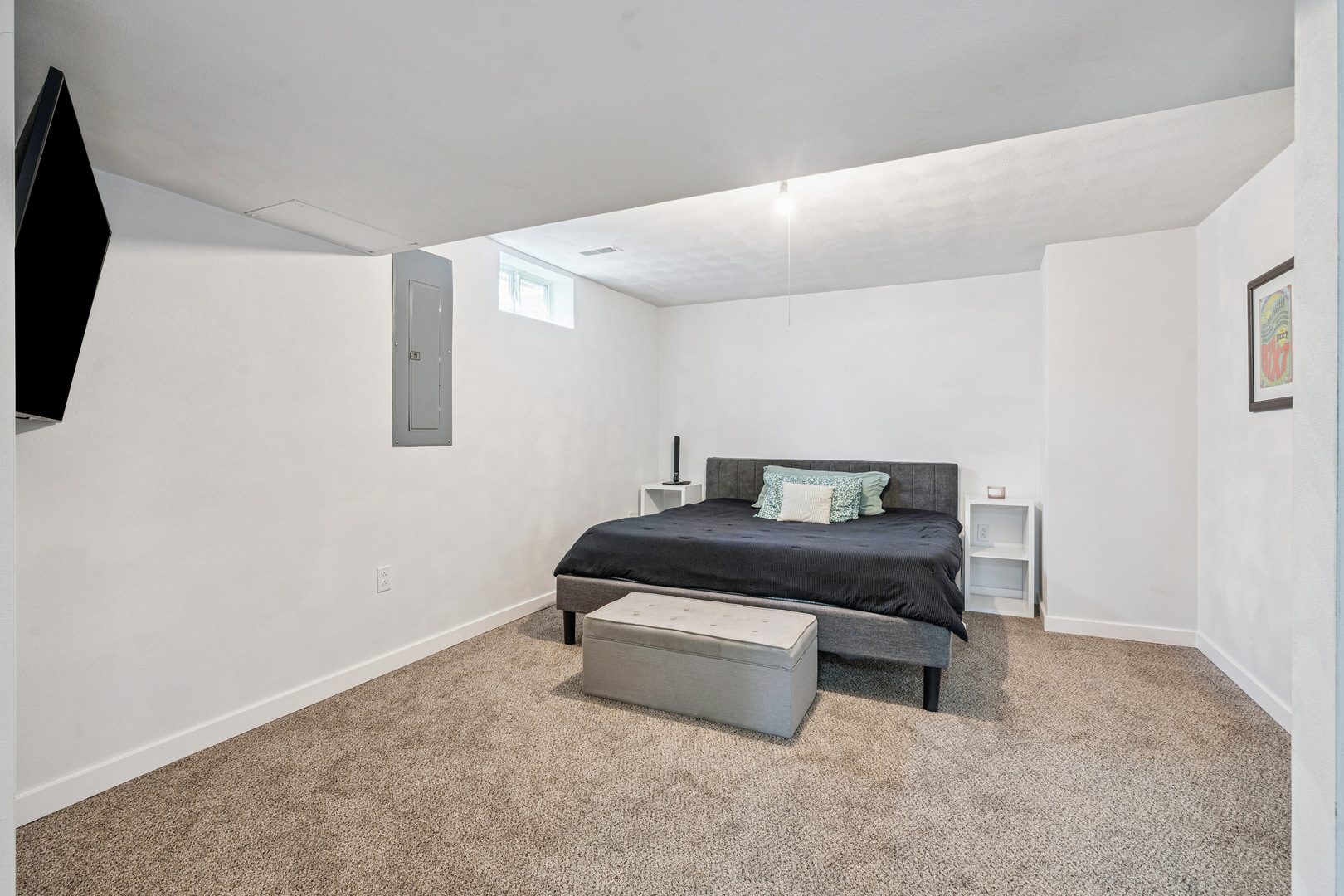 728 10th Ave Court Hampton, IL 61256 - Photo 21 of 35 a bedroom with a bed and a wall painting