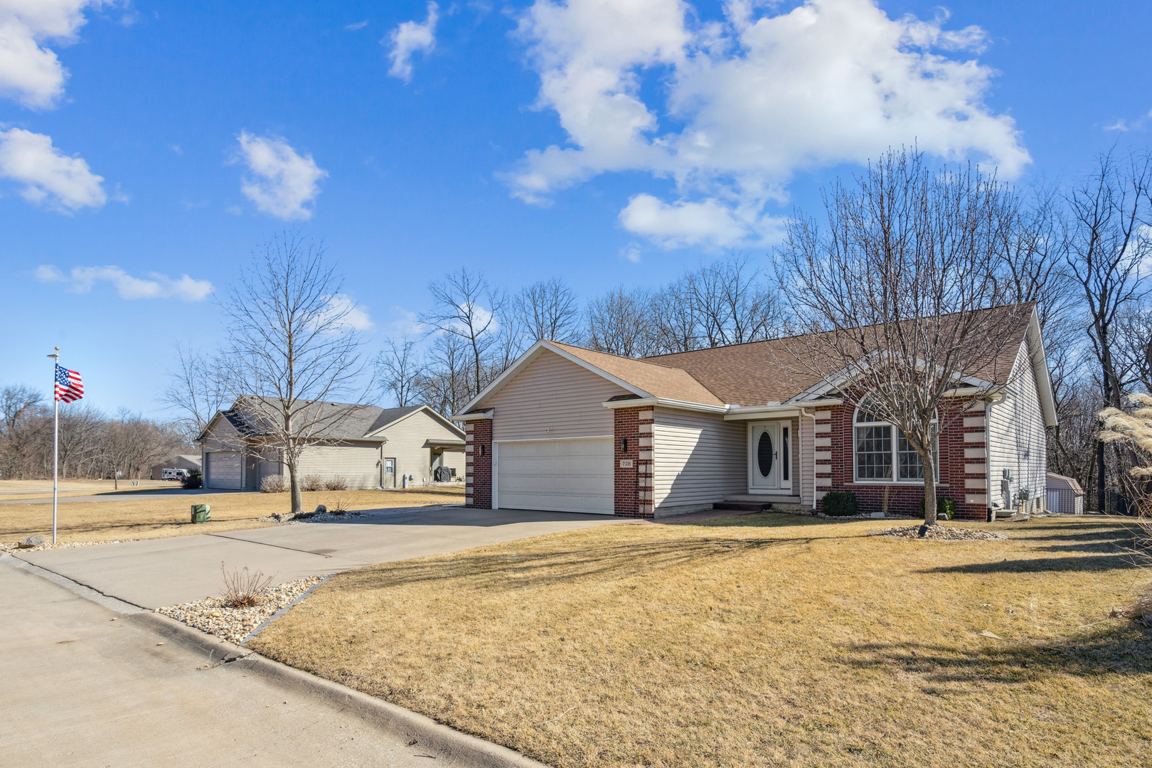 728 10th Ave Court Hampton, IL 61256 - Photo 3 of 35 a house with trees in the background