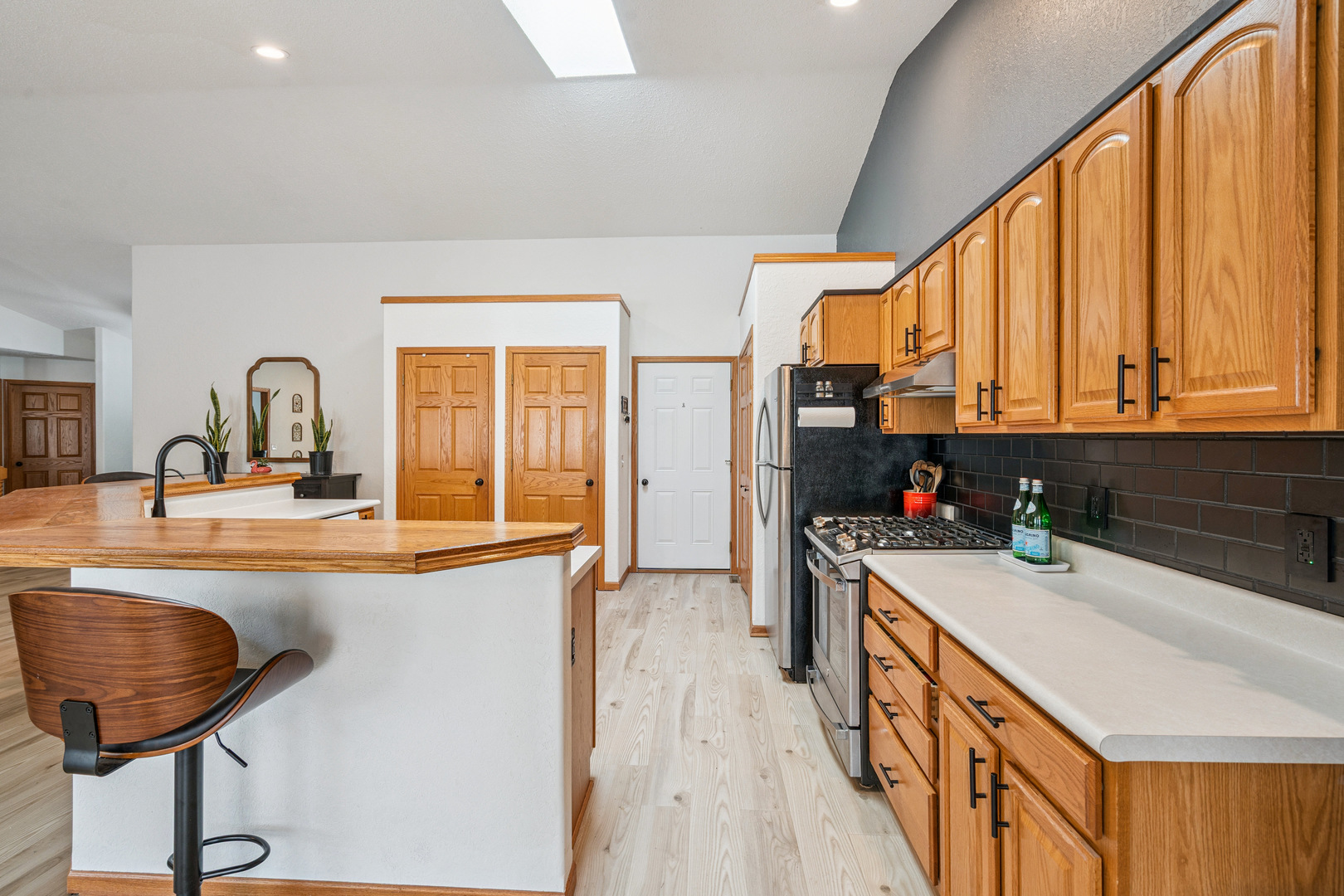 728 10th Ave Court Hampton, IL 61256 - Photo 7 of 35 a kitchen with stainless steel appliances a sink a stove and a refrigerator