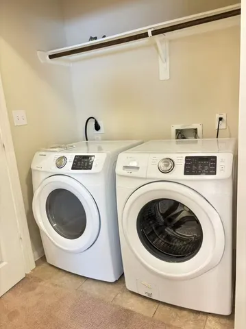a view of room with a ceiling fan and window