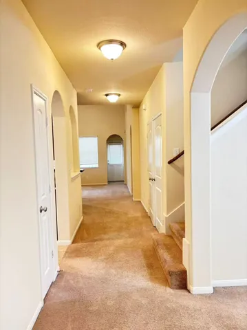 a view of a hallway with front door