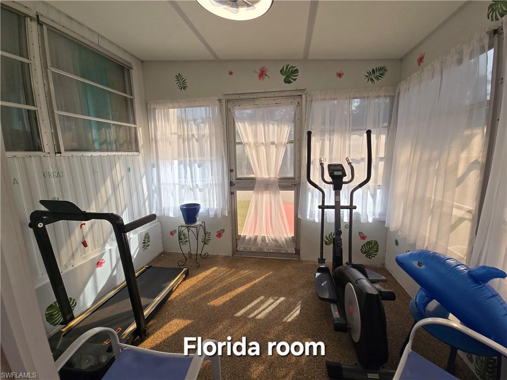 19 Moorhead Manor Naples, FL 34112 - Photo 26 of 33 a view of a room with gym equipment