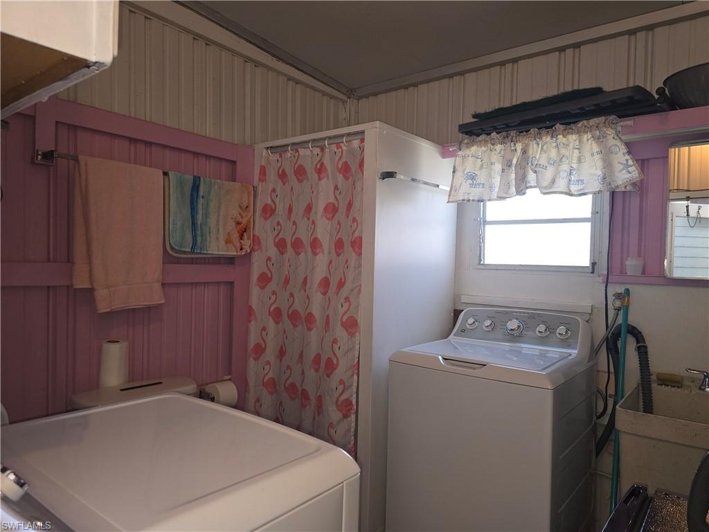 19 Moorhead Manor Naples, FL 34112 - Photo 28 of 33 a utility room with dryer and washer