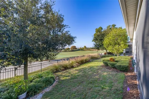a bathroom with a granite countertop double vanity sink mirror and