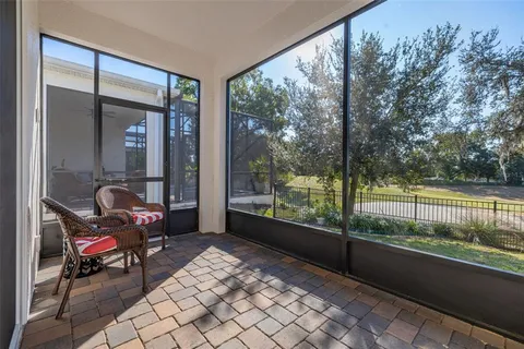 a view of a livingroom with a ceiling fan and window