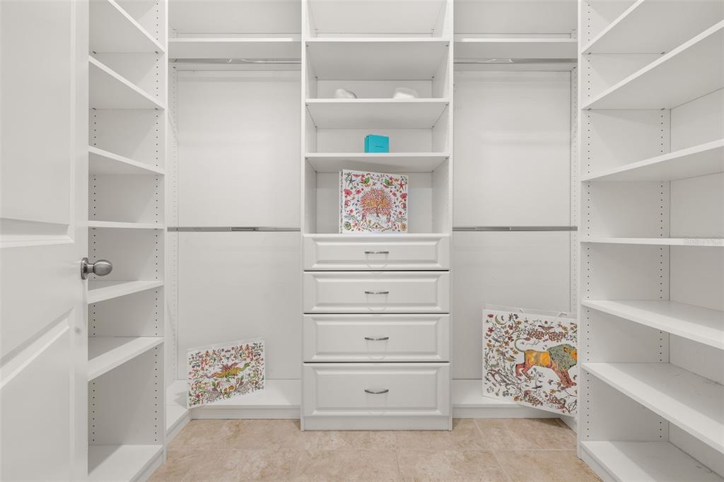 1855 Flora Pass Place Kissimmee, FL 34747 - Photo 21 of 41 a view of walk in closet with clothes and shoes