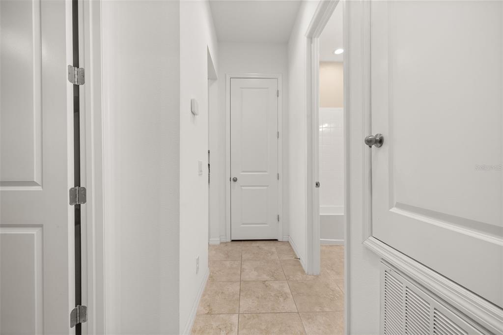 1855 Flora Pass Place Kissimmee, FL 34747 - Photo 24 of 41 a view of a bathroom with a bathtub