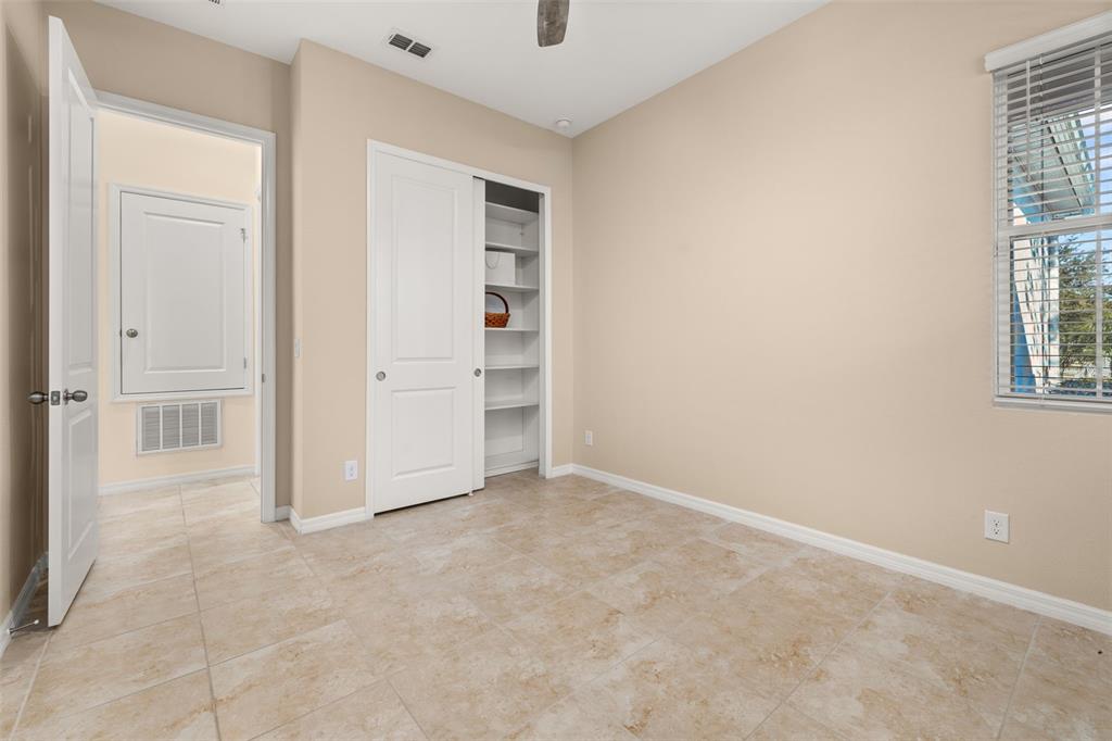 1855 Flora Pass Place Kissimmee, FL 34747 - Photo 25 of 41 an empty room with windows