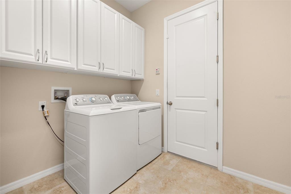 1855 Flora Pass Place Kissimmee, FL 34747 - Photo 28 of 41 a utility room with dryer and washer