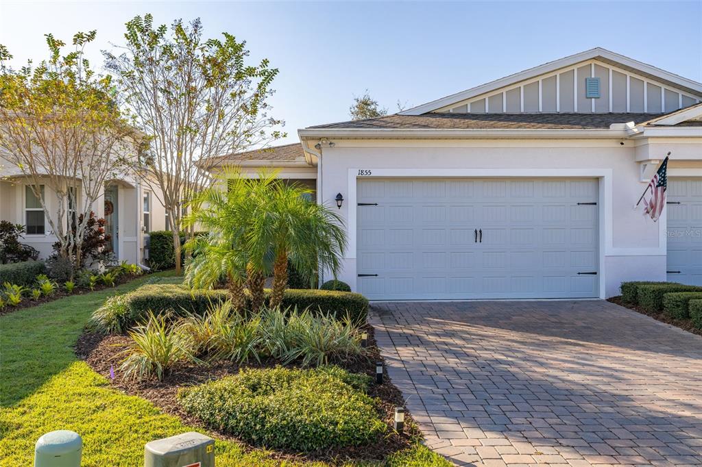 1855 Flora Pass Place Kissimmee, FL 34747 - Photo 39 of 41 a front view of a house with a yard