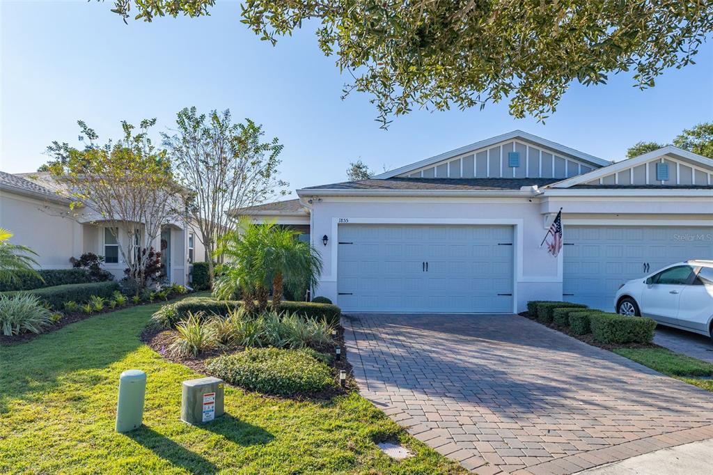 1855 Flora Pass Place Kissimmee, FL 34747 - Photo 40 of 41 a front view of a house with a yard