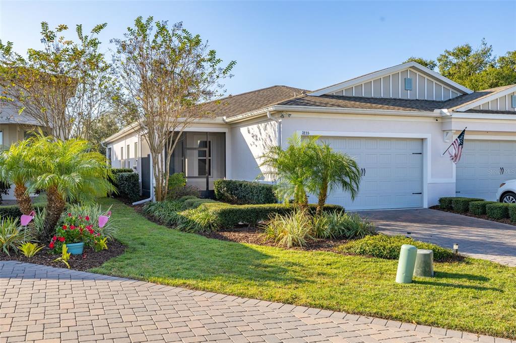 1855 Flora Pass Place Kissimmee, FL 34747 - Photo 41 of 41 a front view of a house with garden