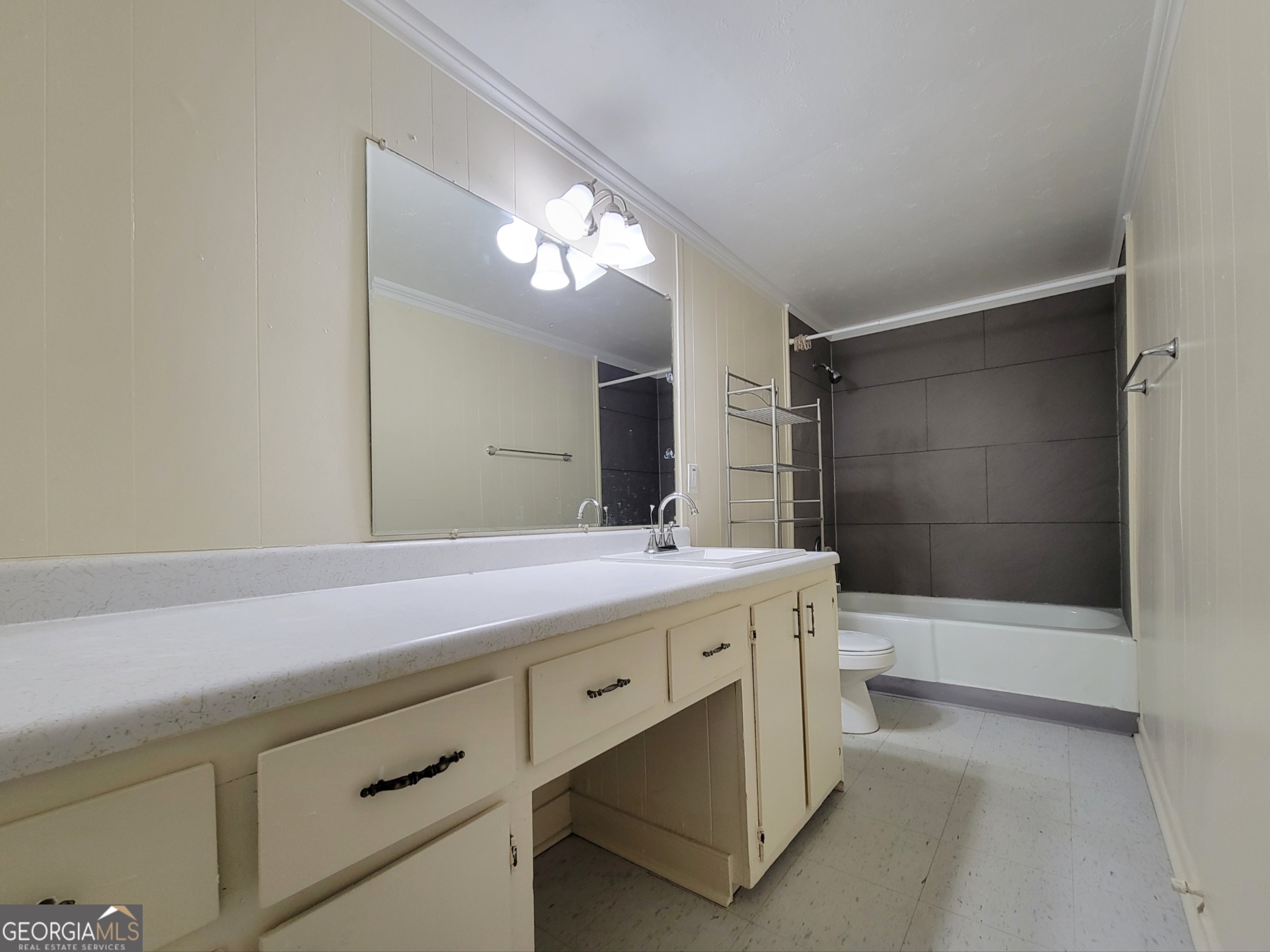 471 Gainesville Highway, Unit 4 Winder, GA 30680 - Photo 6 of 6 a bathroom with a sink a toilet and shower