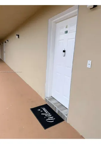 a view of kitchen cabinetry and wooden floor
