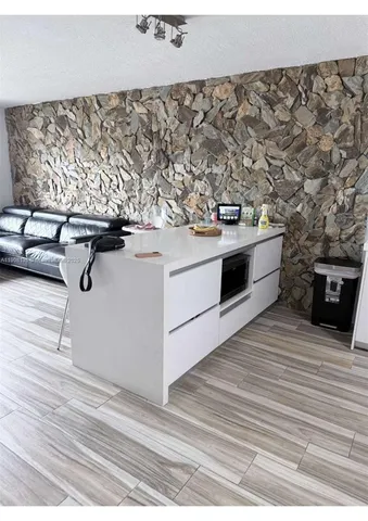 a view of washer and dryer with wooden floor