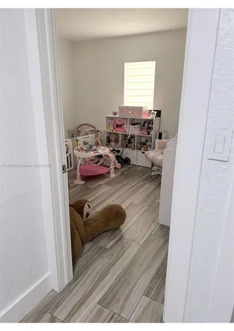 a view of a livingroom with furniture and window