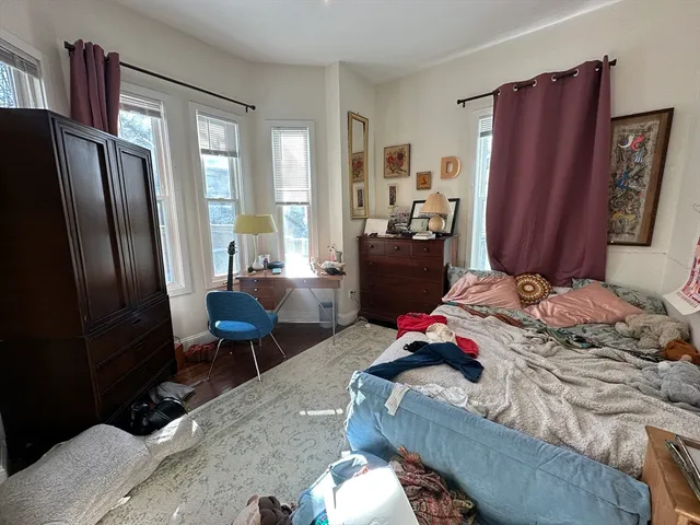 a bedroom with a bed and furniture