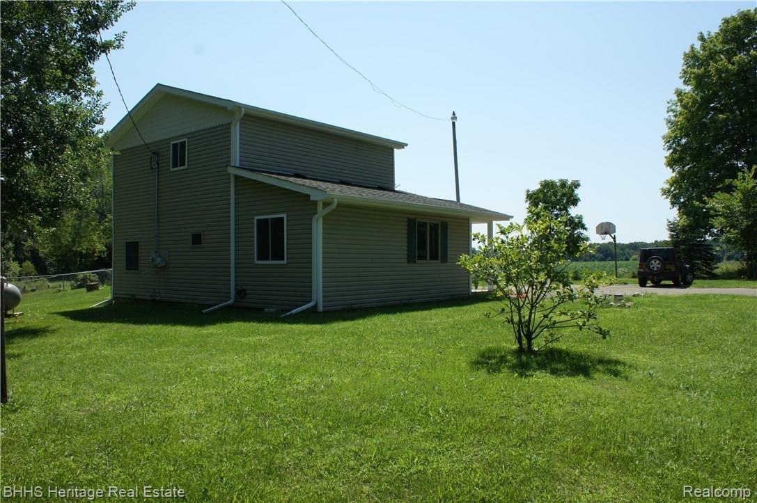 1874 Wallace Road Webberville, MI 48892 - Photo 2 of 7 Rear side view of home