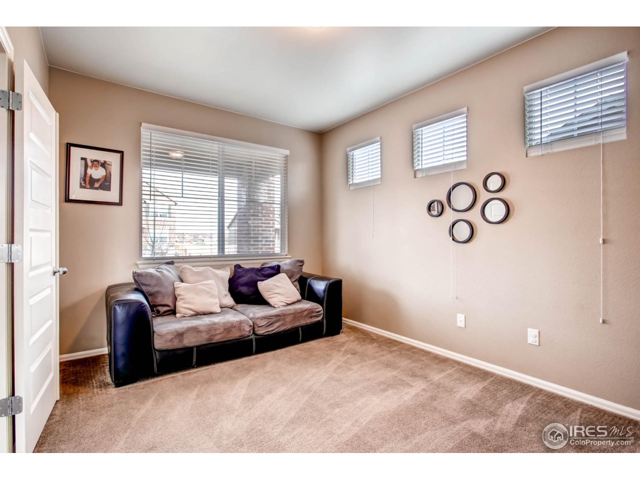 8615 Raspberry Drive Frederick, CO 80504 - Photo 16 of 28 a living room with furniture and a window