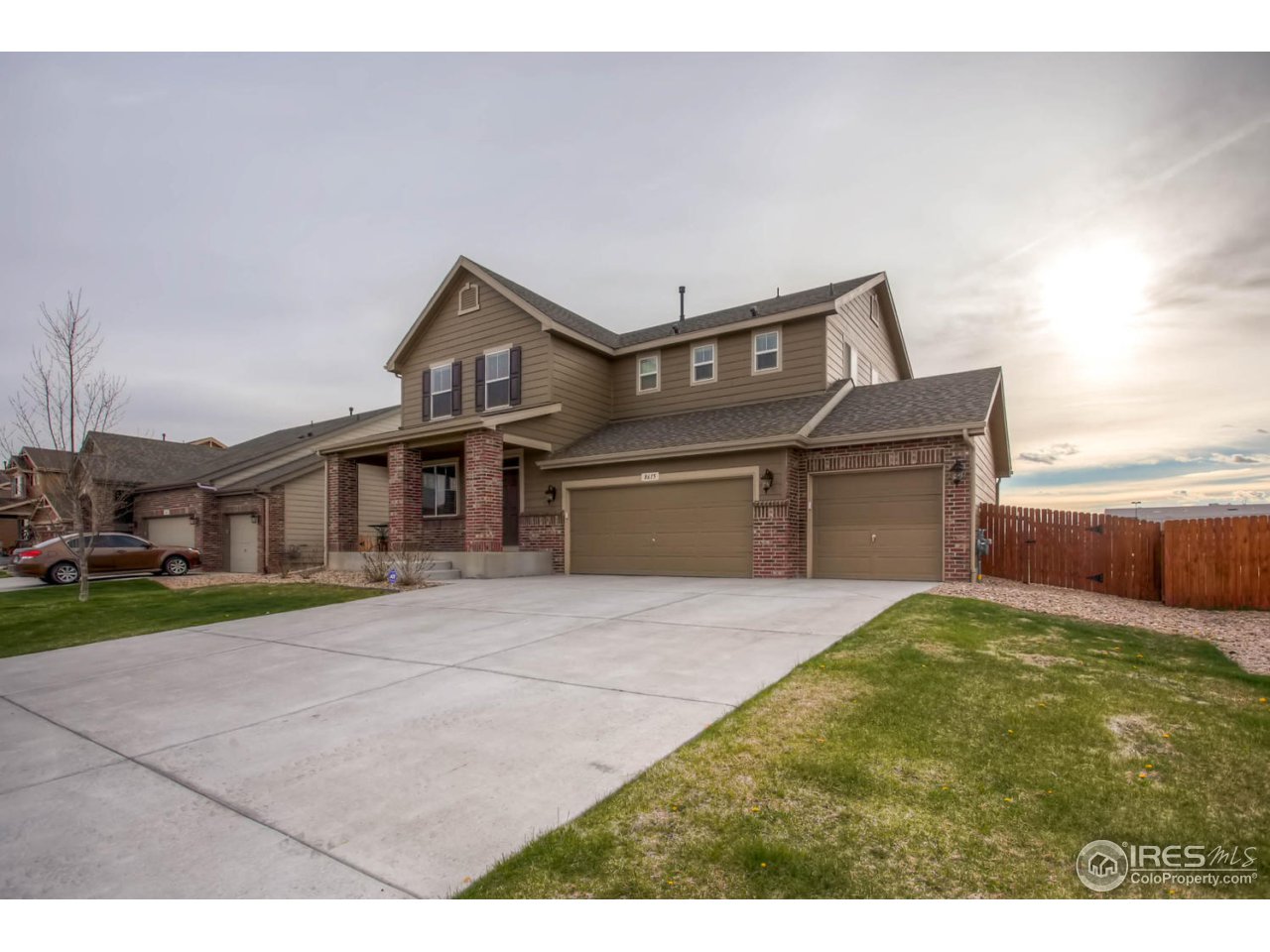 8615 Raspberry Drive Frederick, CO 80504 - Photo 2 of 28 a front view of a house with a yard and garage