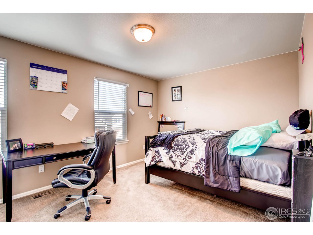 8615 Raspberry Drive Frederick, CO 80504 - Photo 23 of 28 a bedroom with a bed and window