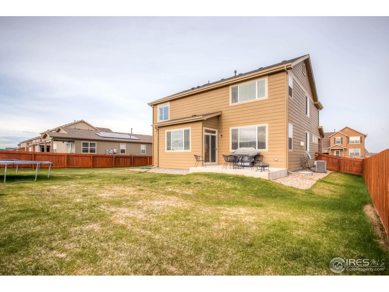 8615 Raspberry Drive Frederick, CO 80504 - Photo 28 of 28 a view of a house with a yard and sitting area