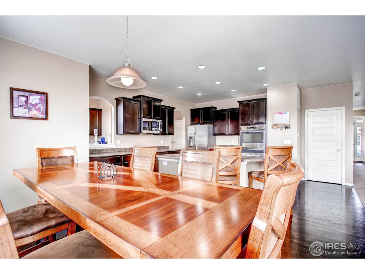 8615 Raspberry Drive Frederick, CO 80504 - Photo 10 of 28 a living room with lots of furniture and kitchen view