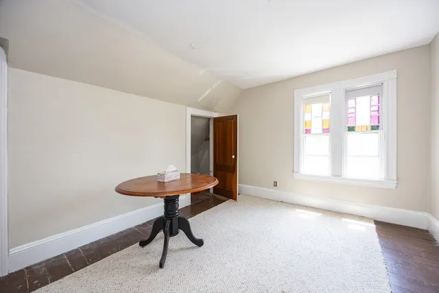 a view of a livingroom with furniture and a window