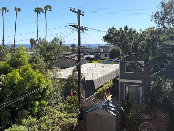 a view of a house with a tree