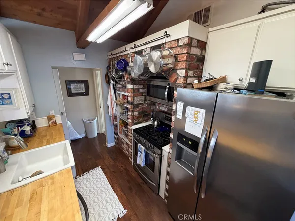 a view of a living room with furniture and a fireplace
