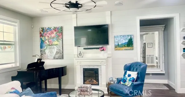 a kitchen with stainless steel appliances granite countertop a sink a stove and a wooden floors