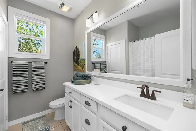 a view of room with walk in closet and window