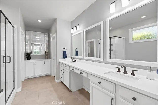 an aerial view of a house with a yard and potted plants
