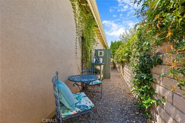 a view of a patio with a table and chairs
