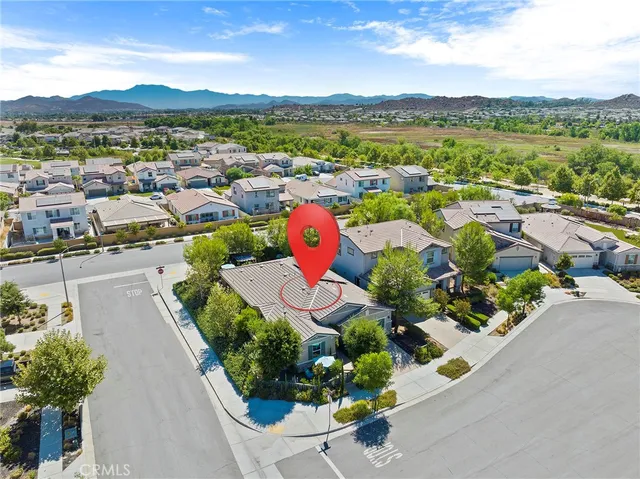 an aerial view of residential houses with outdoor space