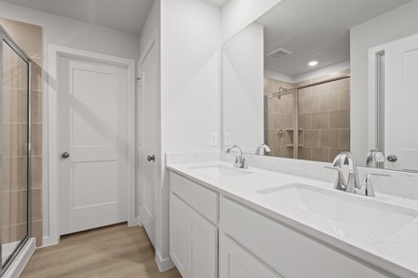 7906 Alset Magnolia, TX 77354 - Photo 11 of 11 a bathroom with a sink and a mirror