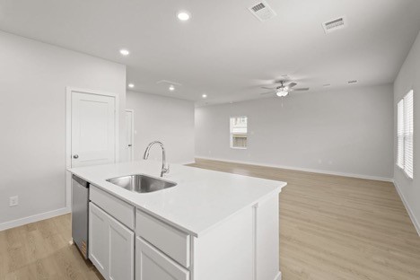7906 Alset Magnolia, TX 77354 - Photo 5 of 11 a kitchen with a sink cabinets and wooden floor