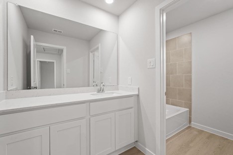 7906 Alset Magnolia, TX 77354 - Photo 6 of 11 a bathroom with a sink and a mirror