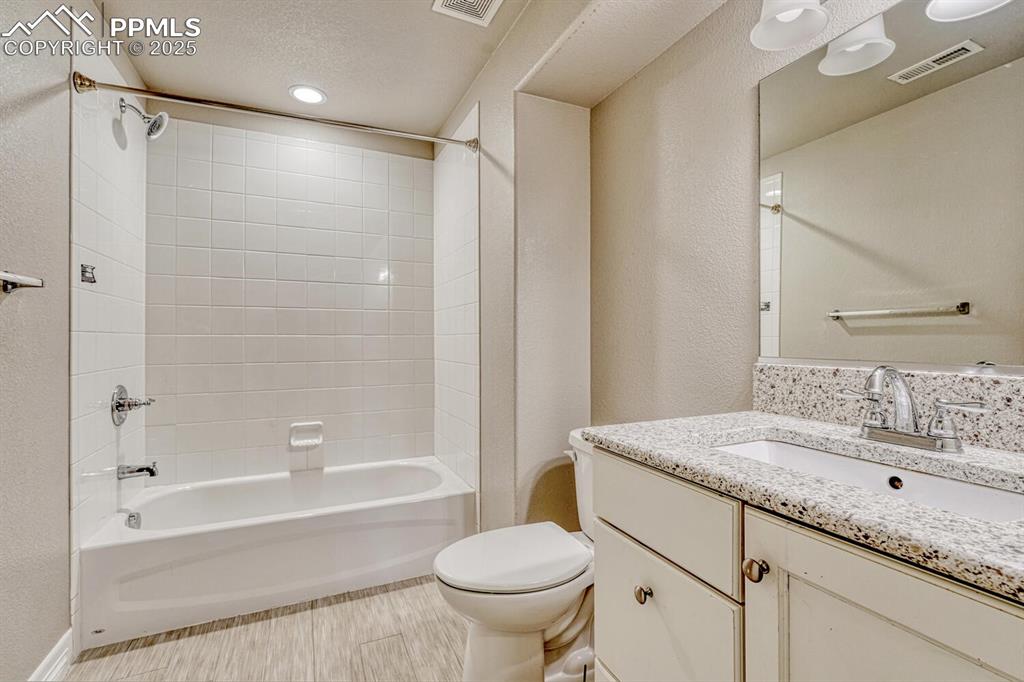 8437 Salt Brush Road Colorado Springs, CO 80908 - Photo 27 of 45 The perfect blend of style and functionality in this gorgeous full bath, equipped with a modern vanity and a spa-inspired shower / bath combination.