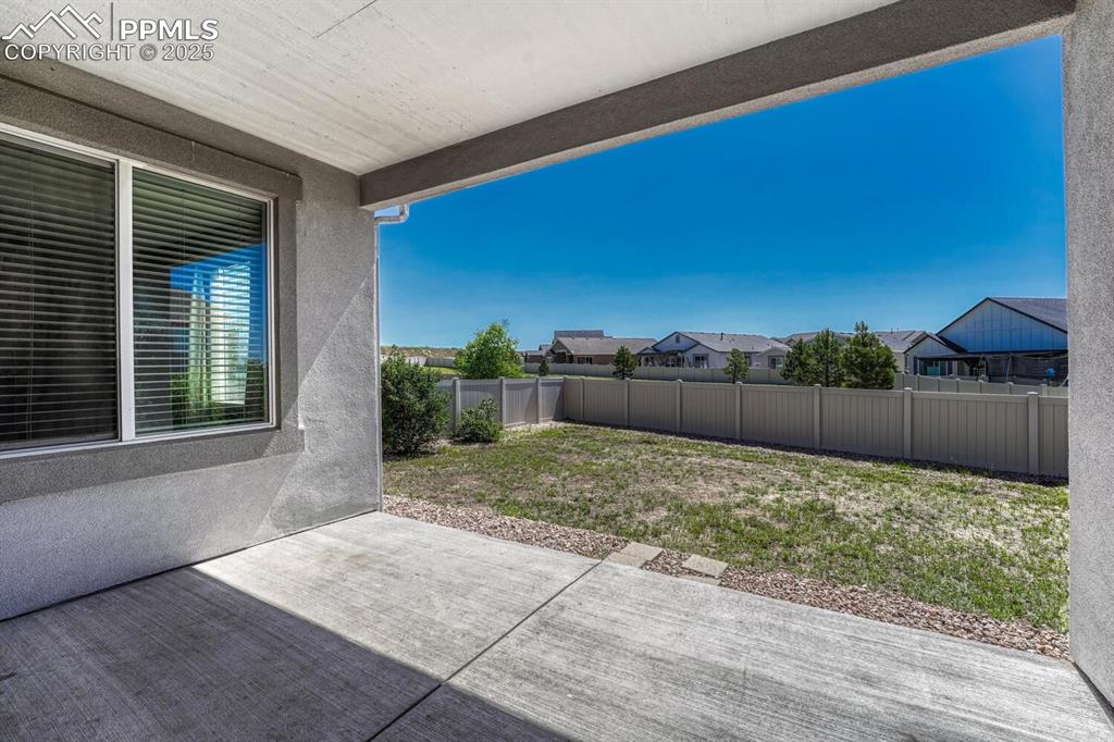 8437 Salt Brush Road Colorado Springs, CO 80908 - Photo 30 of 45 Imagine stepping onto your patio/terrace and being greeted by a stunning residential view that effortlessly flows into the surrounding open space, inviting endless possibilities.