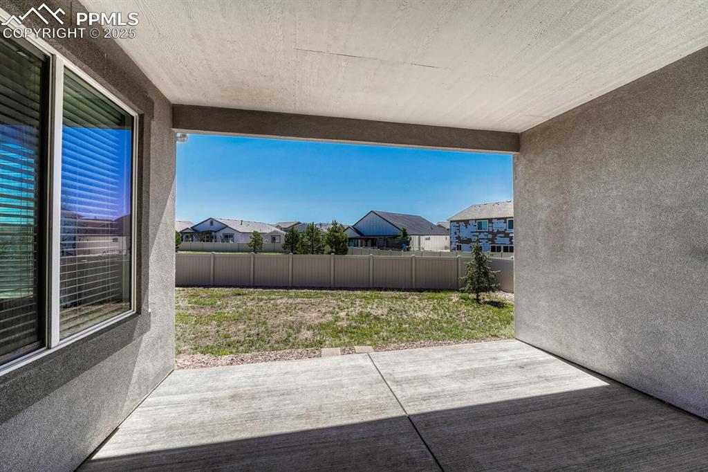 8437 Salt Brush Road Colorado Springs, CO 80908 - Photo 31 of 45 Imagine stepping onto your patio/terrace and being greeted by a stunning residential view that effortlessly flows into the surrounding open space, inviting endless possibilities.