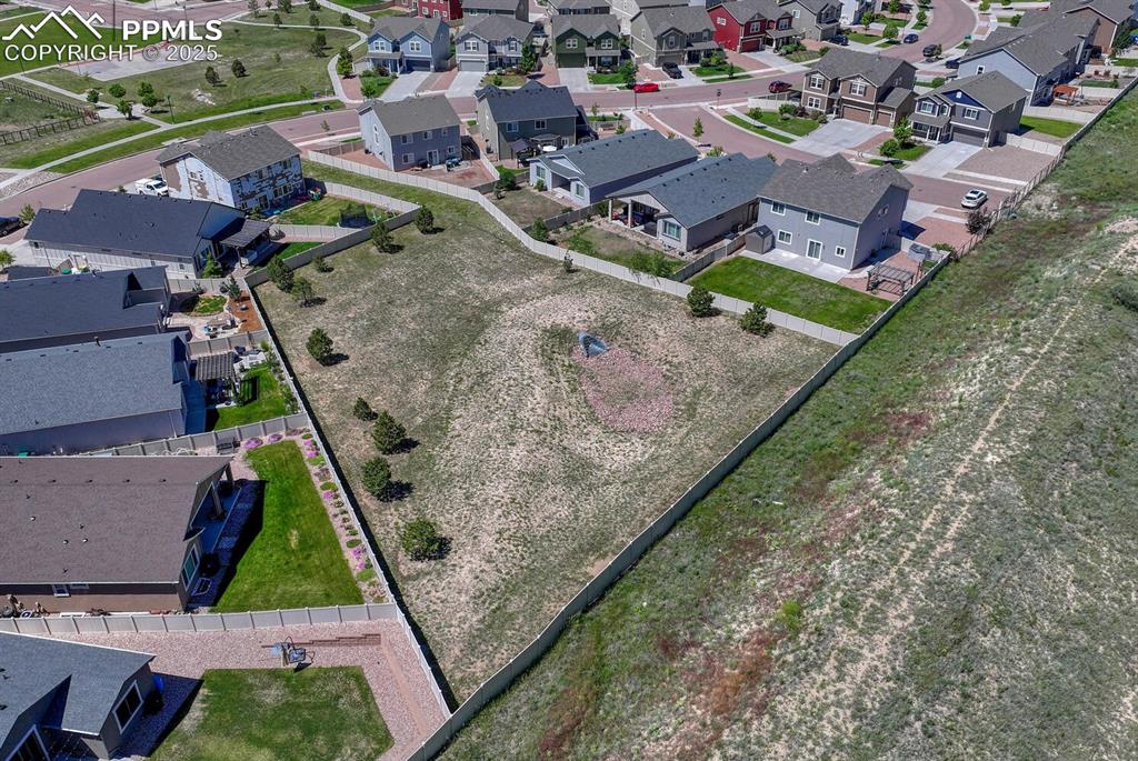 8437 Salt Brush Road Colorado Springs, CO 80908 - Photo 37 of 45 Elevate your perspective with this captivating aerial view, highlighting the property's prime location within a desirable suburban area, full of promise and potential.