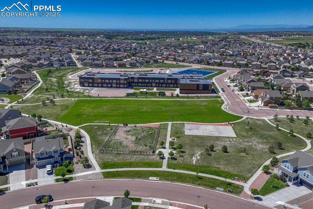 8437 Salt Brush Road Colorado Springs, CO 80908 - Photo 40 of 45 Elevate your perspective with this captivating aerial view, highlighting the property's prime location within a desirable suburban area, full of promise and potential.